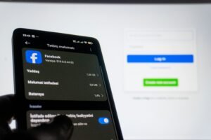 Facebook app settings on smartphone showing data usage and login screen,representing social media management and agency tools in the Costa Del SOl